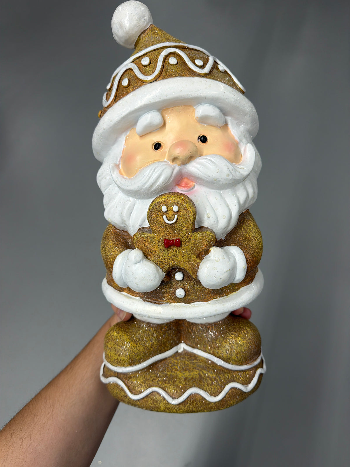 Santa Holding Gingebread Man