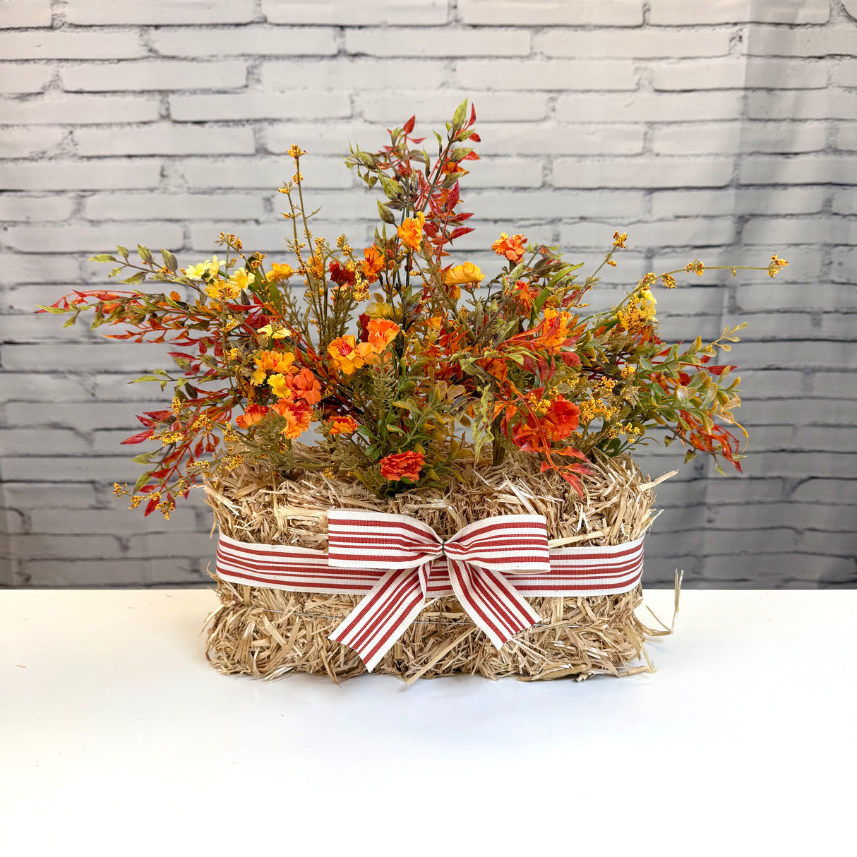 Straw Bale Mum Arrangement